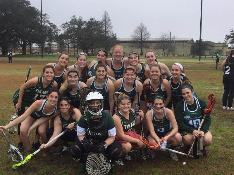 Group photo of Women's Lacrosse on a field.
