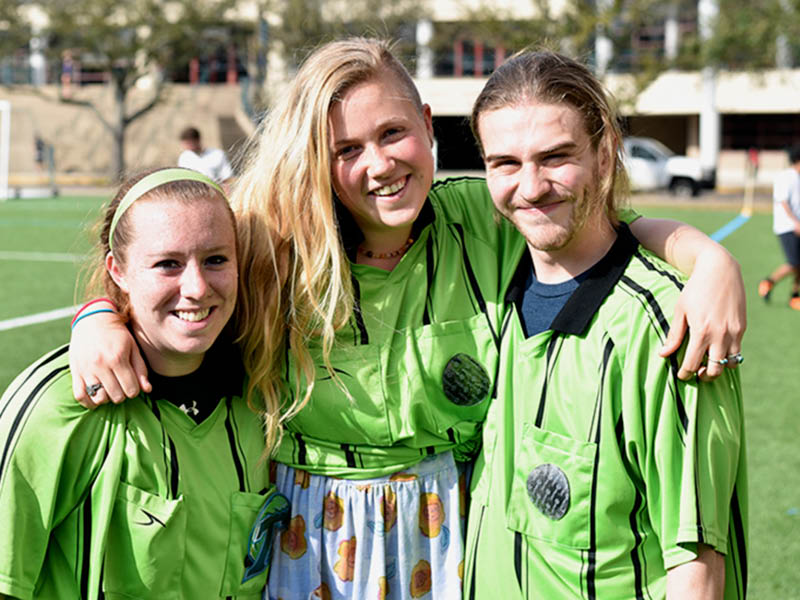 Three Intramural Sport officials in the stripped polos. 