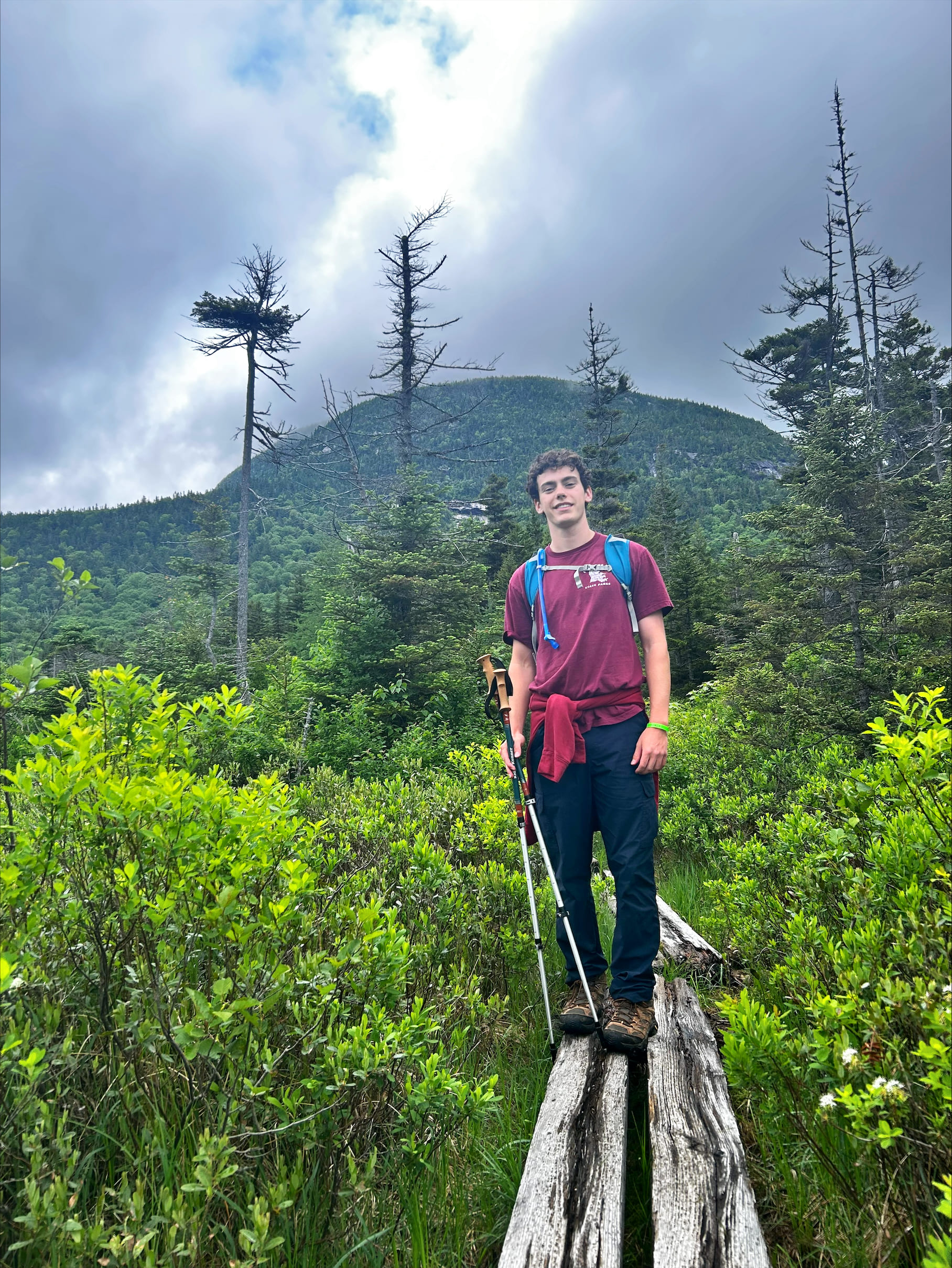 Young man standing on trail
