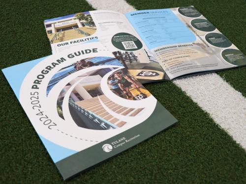 Two copies of the 2024-2025 Program Guide on turf. Two copies of the 2024-2025 Program Guide on turf.